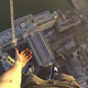 Image for article titled Guy jumps over huge gap to hang 490-feet above London with one hand